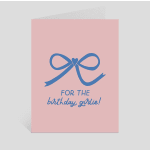 Pink birthday card with a blue bow and text