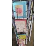 Display rack of Mother's Day greeting cards with floral designs.