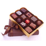 Box of assorted chocolates with a ribbon-tied gift box