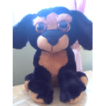 Black and tan plush dog toy with large eyes