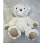 White plush teddy bear with tan paw pads on a fluffy white background