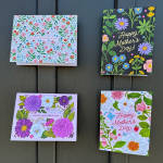 Set of four colorful Happy Mother's Day greeting cards with floral illustrations