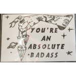 Decorative sign with crystals and the words "YOU'RE AN ABSOLUTE BADASS"