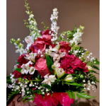 Pink and white mixed flower arrangement with a small angel figurine