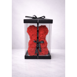 Red rose teddy bear in a clear gift box with a black ribbon