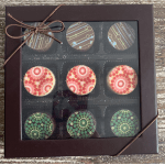 Box of assorted decorated chocolates tied with a ribbon