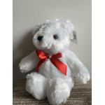 White plush teddy bear with a red ribbon bow