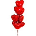 Cluster of red heart-shaped balloons tied together