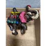 Colorful ceramic elephant figurine inside a wooden box