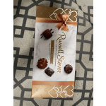 Box of assorted milk and dark chocolates with a ribbon bow