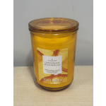 Amber glass jar candle with citrus-themed label