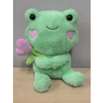Green plush frog holding a pink heart