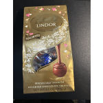 Gold box of Lindt Lindor assorted chocolate truffles with heart decorations