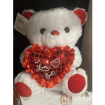 White teddy bear holding a red heart with "I Love You" text