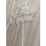 White script cake topper reading "Oh Baby" on a stick