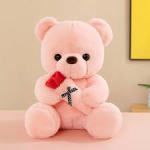 Pink teddy bear plush with a red bow and small ribbon detail