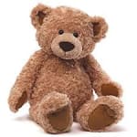 Brown teddy bear sitting on a white background