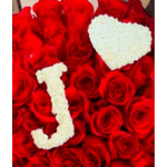 Red roses arranged around white letters J and T.