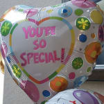 Heart-shaped balloon with the words "You're so special!"
