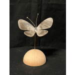 Decorative butterfly sculpture on a wooden base