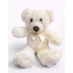Cream teddy bear with a ribbon bow on a white background