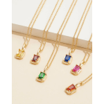 Five gold necklaces with colorful rectangular gemstone pendants