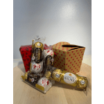 Ferrero Rocher chocolates and heart-patterned gift boxes on a table