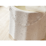 White textured gift box with a silver heart chain draped across it