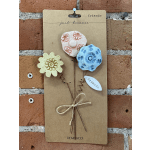 Decorative card with three flower-shaped ornaments and friendship text