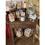 Assorted packaged snacks and decorative bunny cutouts on a rustic wooden display