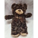 Brown teddy bear with a satin bow on a light background