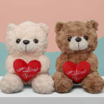 Two plush teddy bears holding red hearts with "I Love You" text