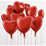 Cluster of red heart-shaped balloons on strings