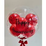 Clear balloon filled with red balloons and "Happy Anniversary" text