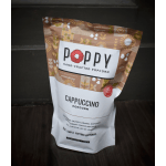 Bag of Poppy cappuccino popcorn on a dark surface