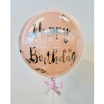 Pink birthday balloon with a satin ribbon bow