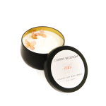 Black candle tin with cherry blossom wax and lid beside it