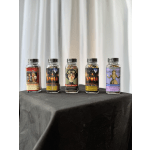 Five labeled tea jars on a black cloth-covered table