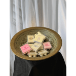 Tray of assorted wax melts in plastic clamshells