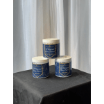 Three jars of whipped body butter stacked on a table