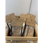 Assorted air freshener packets in a wooden tray