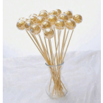 Gold-wrapped chocolate lollipops in a clear glass vase