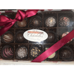 Box of assorted chocolates tied with a pink ribbon