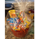 Gift basket of assorted candy wrapped in clear cellophane with colorful ribbons