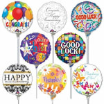 Assorted round foil balloons with congratulatory messages