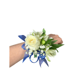 White rose wrist corsage with blue ribbon and small white flowers