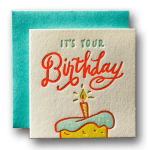 Birthday card with a cake illustration and teal envelope