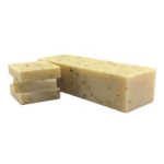 Wedge of pale yellow cheese with a few slices cut off