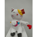 Plush cat toy holding a red heart