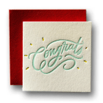 Two square greeting cards, one red and one cream with "Congrats" lettering.